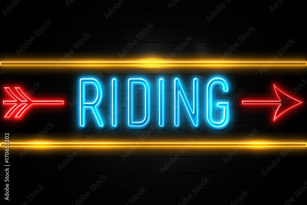 Riding  - fluorescent Neon Sign on brickwall Front view