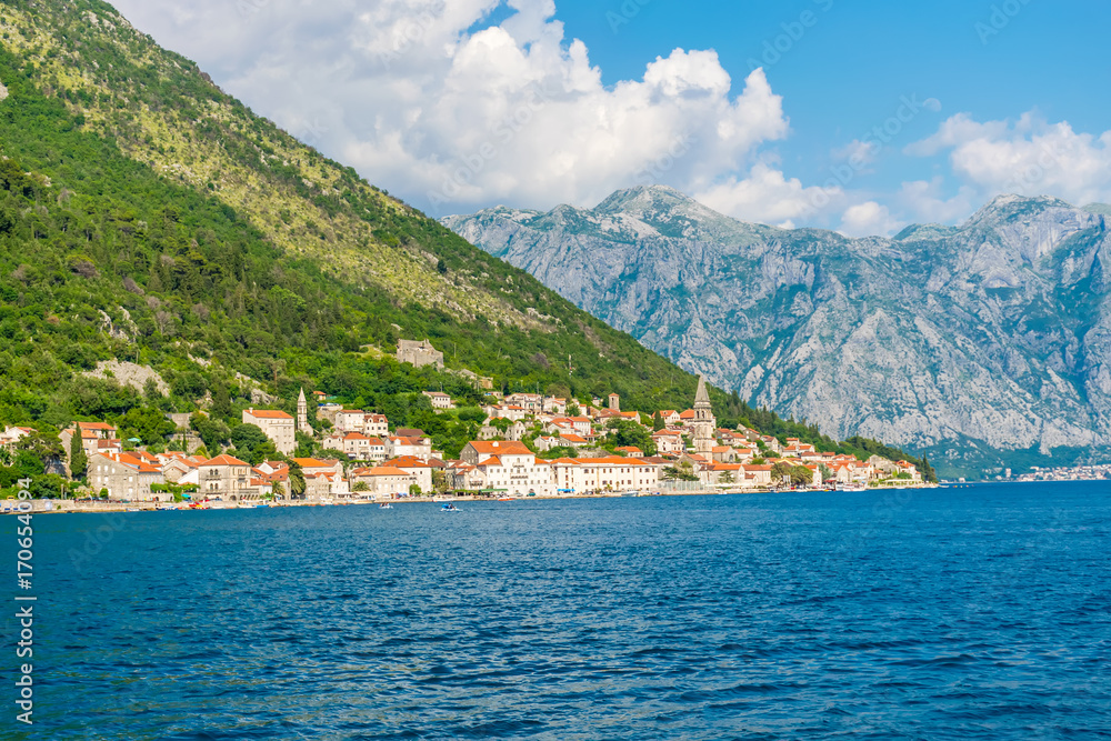 Sailing on the yacht past the city of Perast in Montenegro.