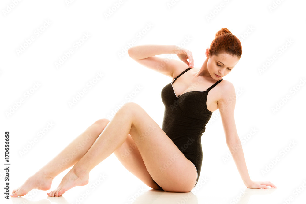 Sitting woman in underwear showing smooth legs