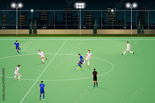 People Playing Soccer at Night