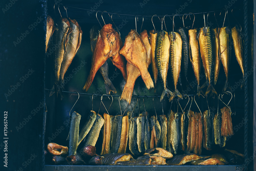 Fish Smoking Process, marine fish in smokehouse Stock Photo | Adobe Stock