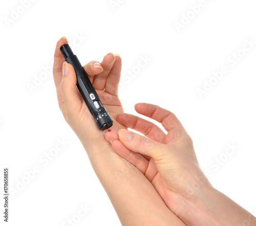 Diabetes lancet in hand prick finger to make punctures to obtain small blood specimens