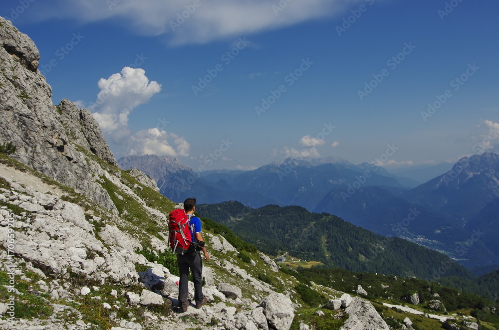 Young man hiking in the Dolomites