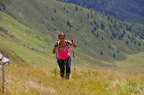 Obraz na płótnie Young woman hiking in the Dolomites w salonie