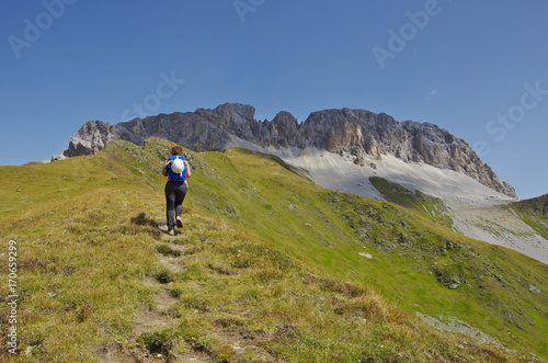 Obraz na płótnie Young woman hiking in the Dolomites w salonie