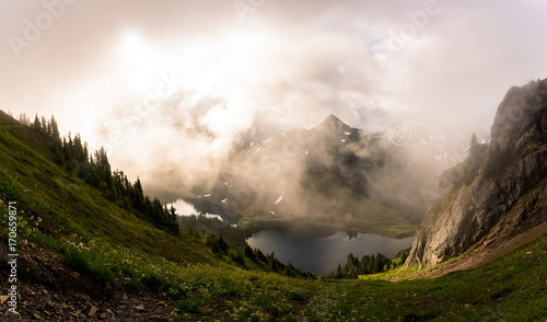 The magical light and clouds that drape the mountains of the North Cascades National Park can mesmerize anyone visiting this special place.  photo