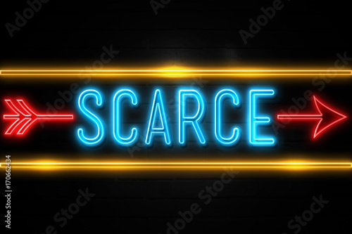 Scarce  - fluorescent Neon Sign on brickwall Front view