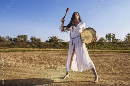 фотографія Shaman woman  drumming  away