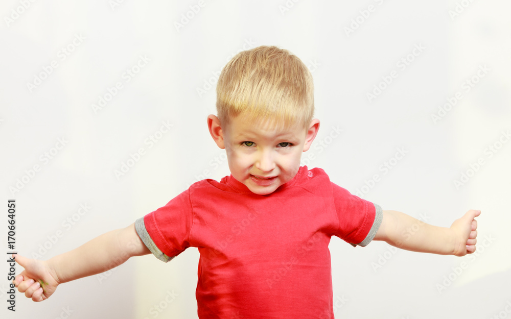 Little boy playing showing thumb up gesture