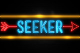 Seeker  - fluorescent Neon Sign on brickwall Front view