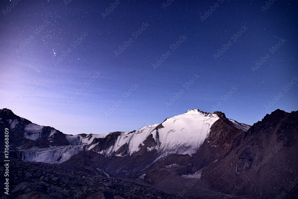 Fototapeta Snow peak under night sky