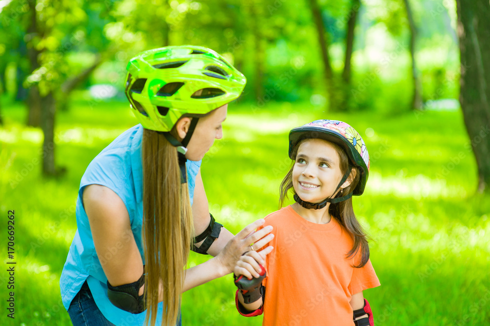 Mom teaches daughter rollerblading Mom teaches daughter rollerblading