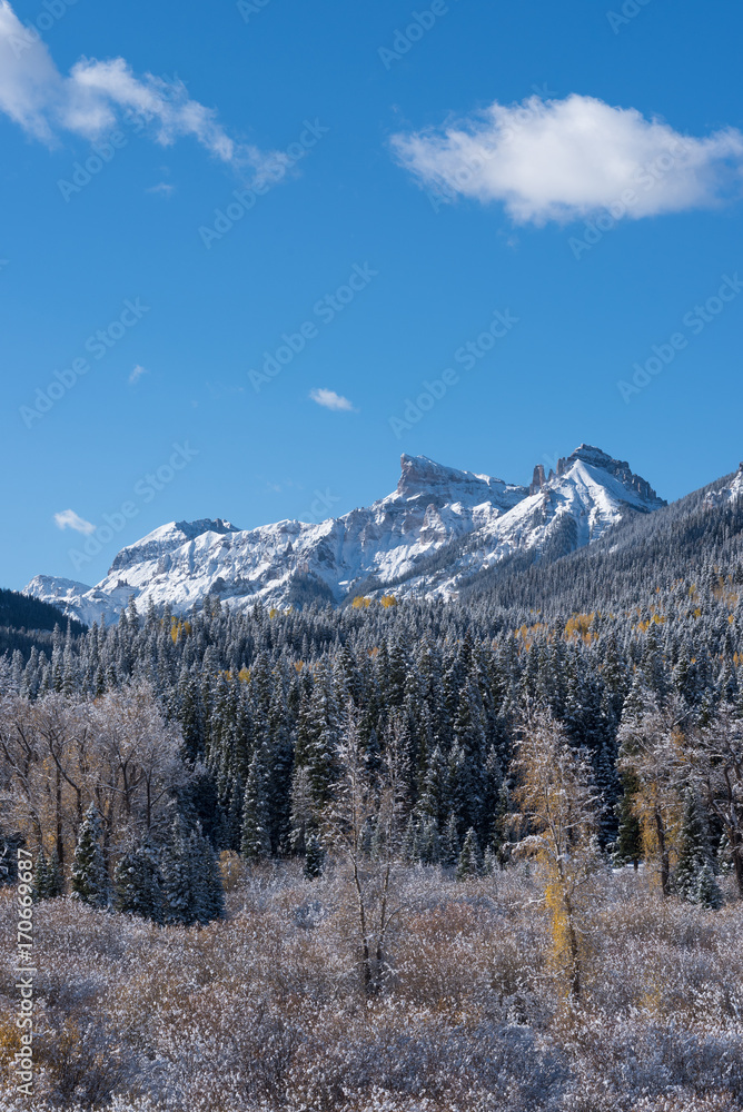 Coxcomb Peak viewed from Cimarron River Valley after early fall snow storm. Located in the Uncompahgre National Forest, Colorado.
