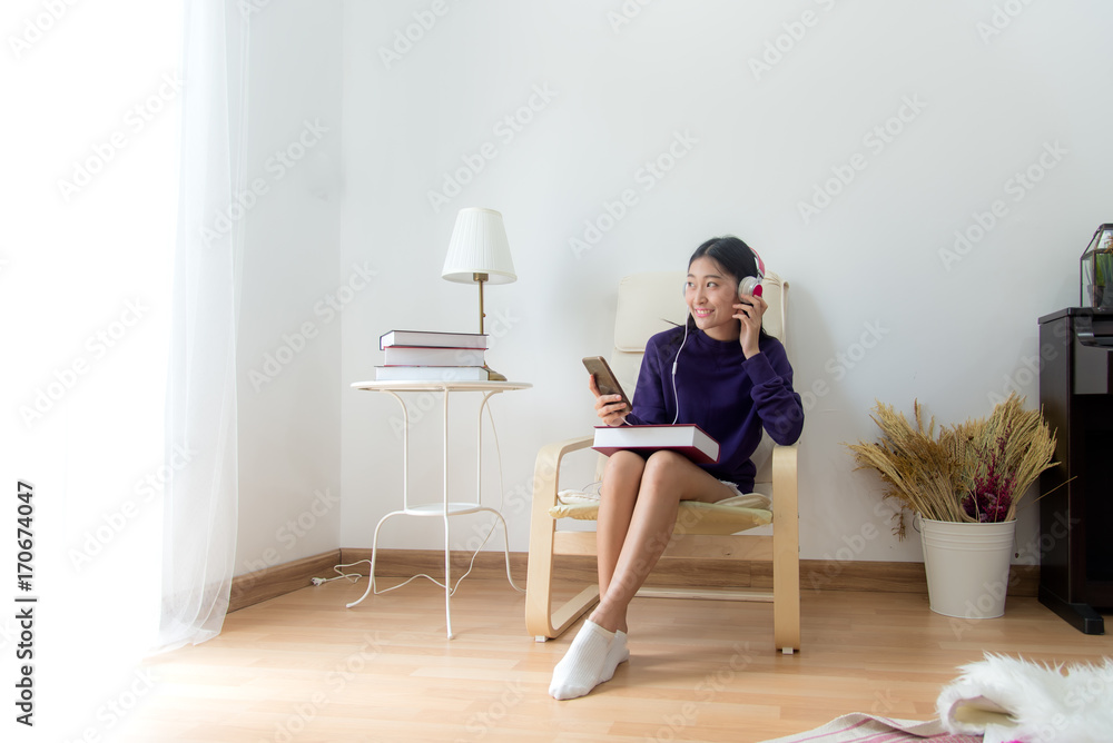 Inspired young asian woman listening the music at home, relax and happy life. Lifestyle Concept.