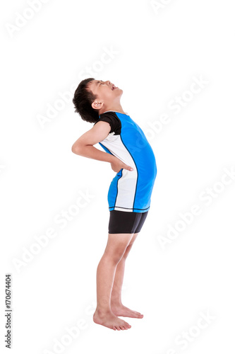 Asian child athletes suffering from low back pain. Isolated on white background.