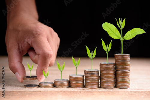Close up of male hand stacking coins ,Business Finance and Money concept,Save money for prepare in the future.