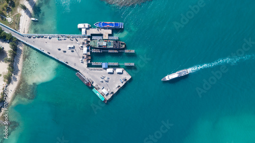 Aerial view of Koh Phangan international port with boats in the clear blue sea