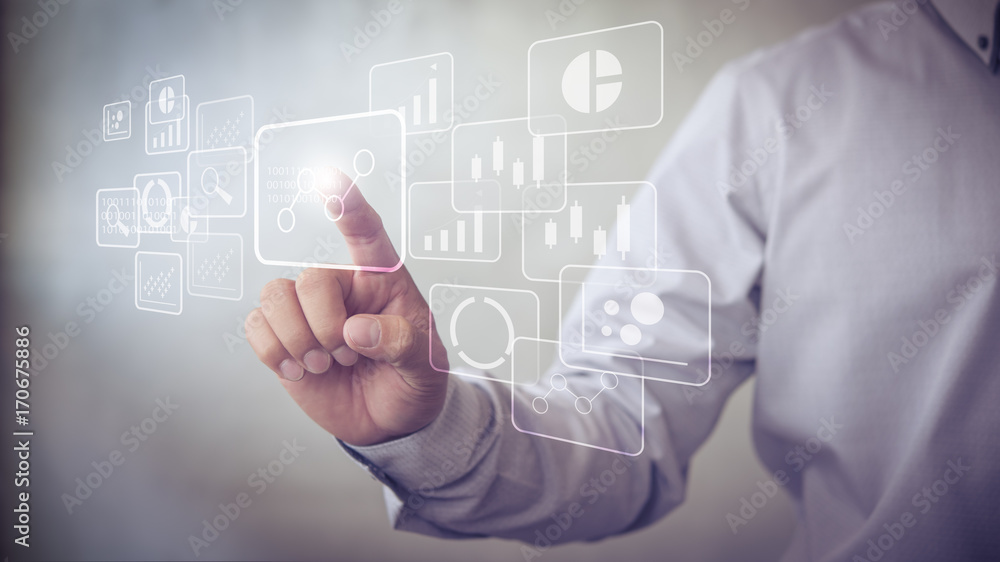 Big data analytics and business intelligence (BI) concept with chart and graph icons on a digital screen interface and a businessman in background Big data analytics and business intelligence (BI) concept with chart and graph icons on a digital screen interface and a businessman in background