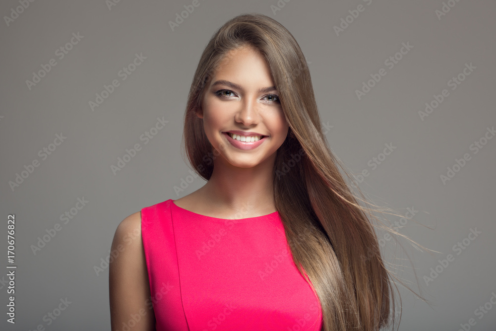 Fototapeta premium Portrait of young beautiful smiling happy woman. Long hair.