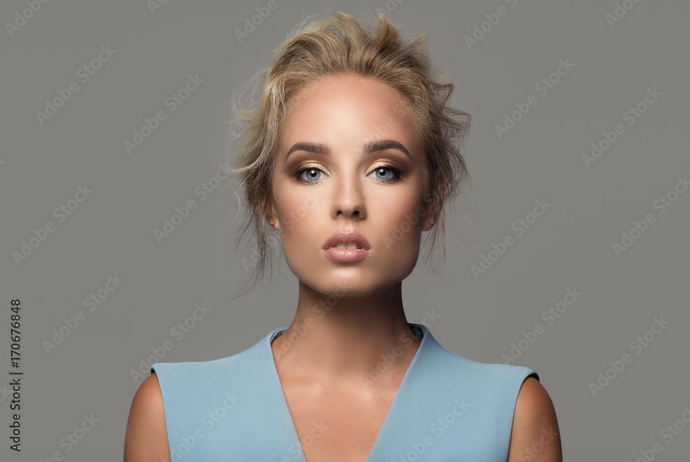 Fashion portrait of beautiful woman. Gray background. Fashion portrait of beautiful woman. Gray background.