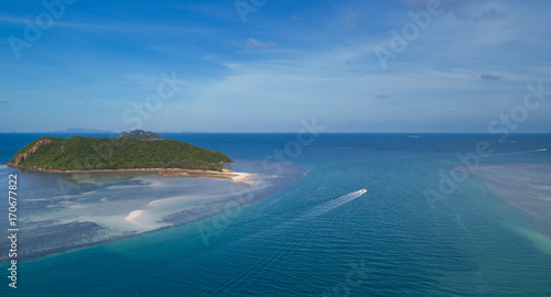 Aerial view of Thongsala bay Koh Phangan with boats in the clear blue sea photo