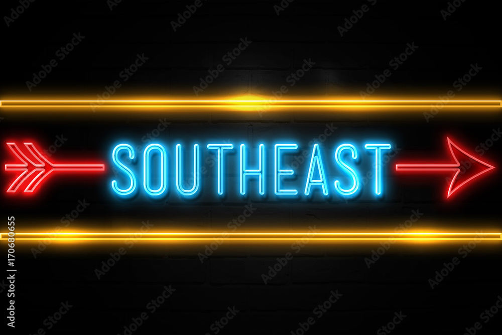 Southeast - fluorescent Neon Sign on brickwall Front view Southeast - fluorescent Neon Sign on brickwall Front view