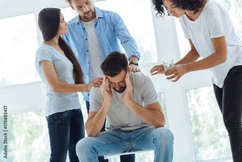 Obraz premium Cheerless bearded man having a migraine