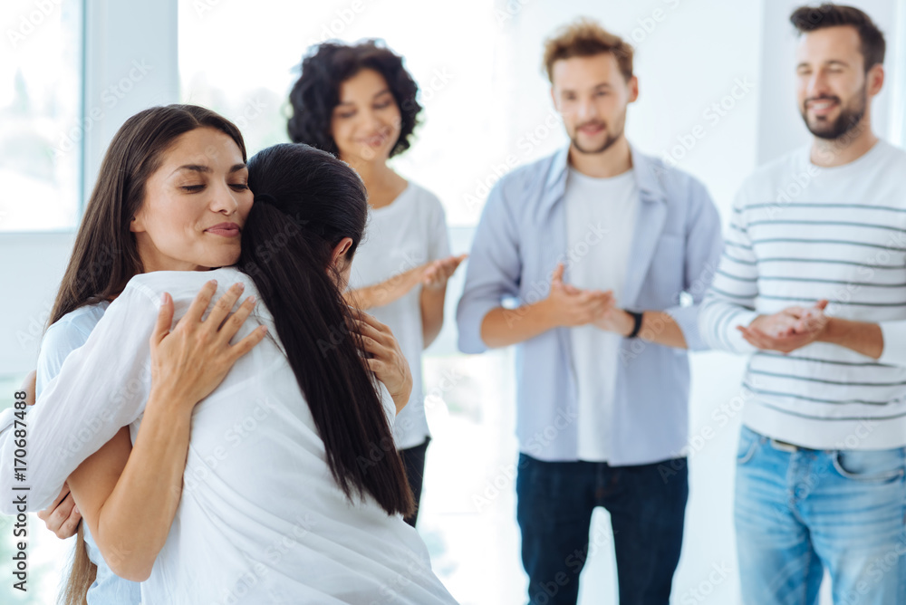 Nice delighted woman hugging her therapist Nice delighted woman hugging her therapist