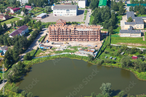 construction of apartment house in settlement photo