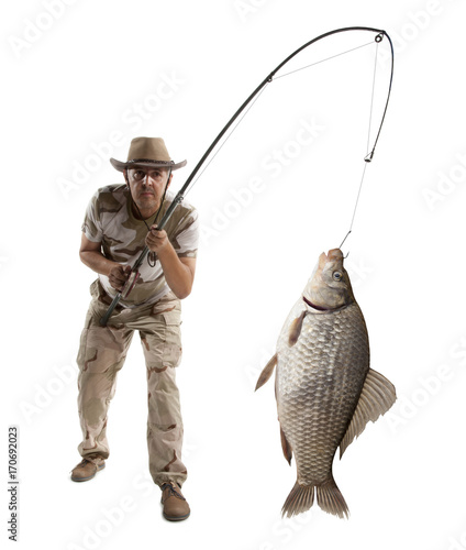 Fisherman with big fish. Crucian carp (Carassius auratus gibelio)