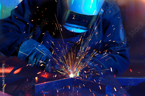 Welder erecting technical steel