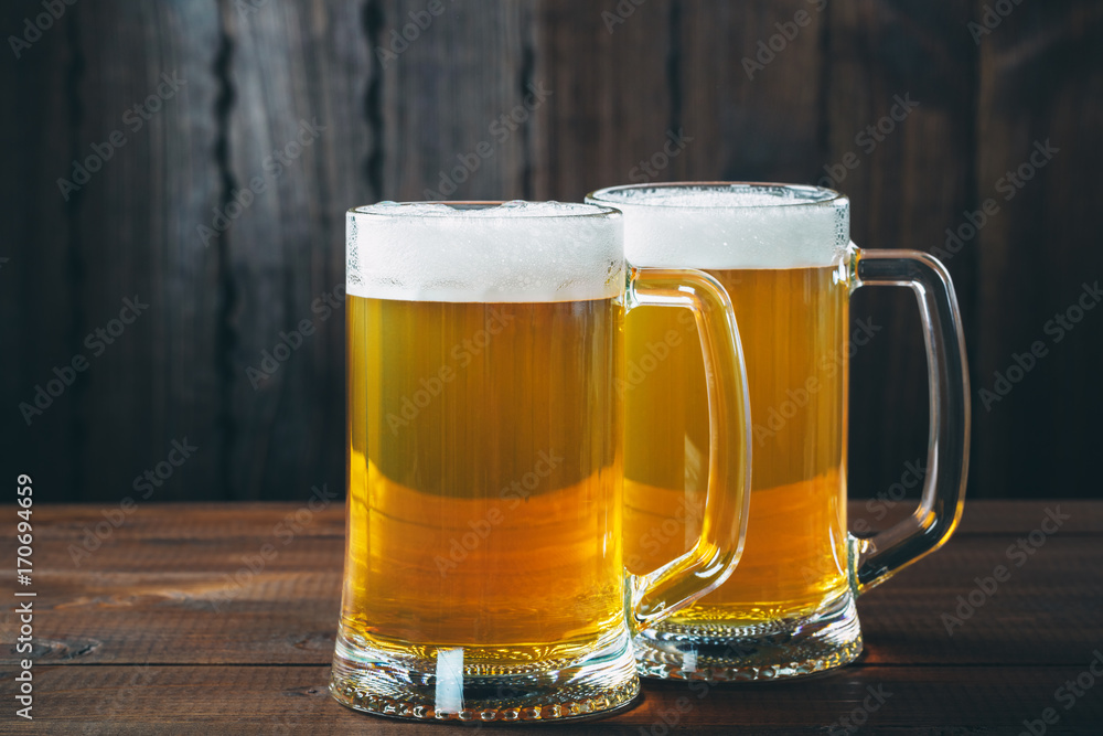 Mug of beer on the wooden background Mug of beer on the wooden background
