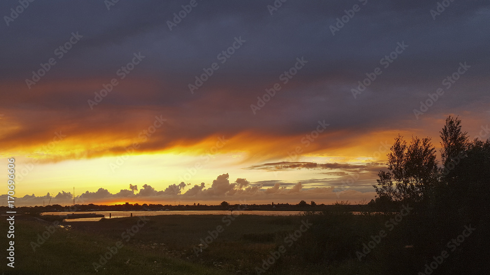 Sunset over Dutch river Lek, Nieuw-Lekkerland, South Holland, Netherlands