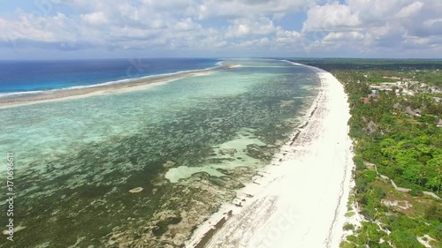 Aerial view of Matemwe Island shore, lagoon and coral barrier reef, clear water, Zanzibar from above photo