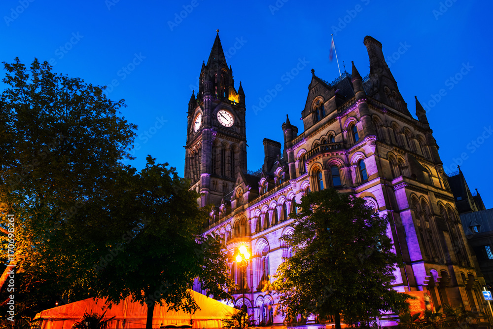 Illuminated Town Hall in Manchester, UK at night