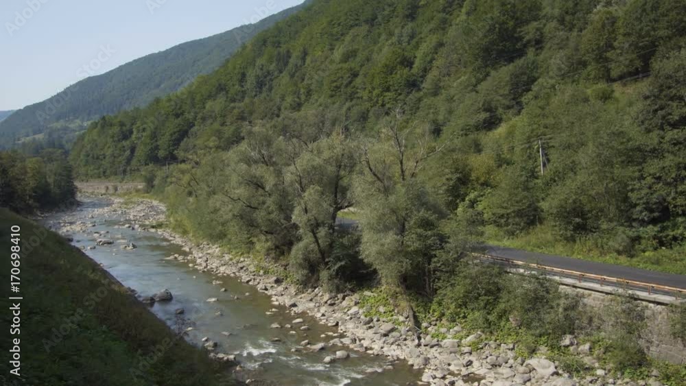 Beautiful mountain views: village, road and river Beautiful mountain views: village, road and river