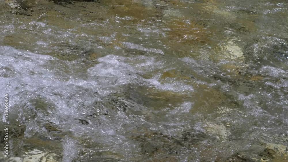 Water in a mountain river in slow motion video. Water in a mountain river in slow motion video.