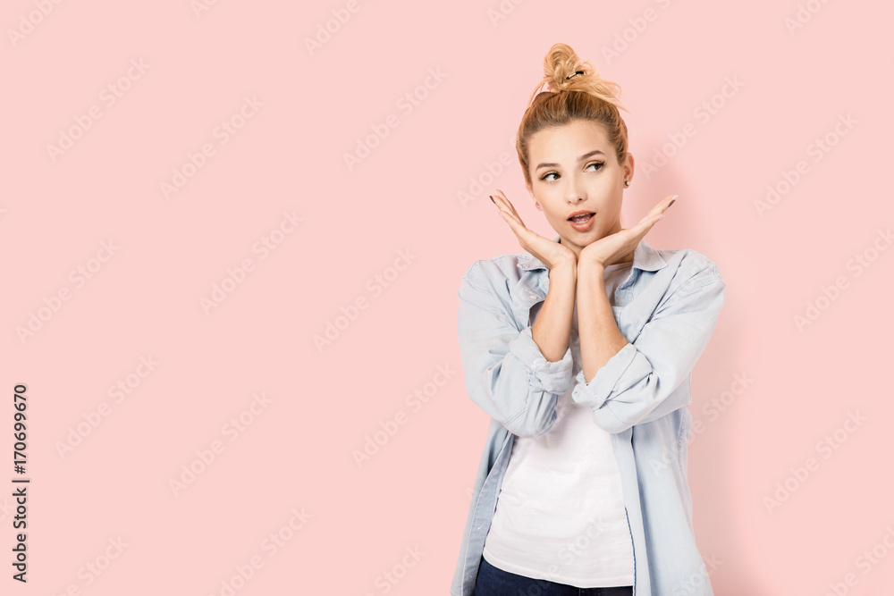 Pretty blonde woman on pink background with copyspace Pretty blonde woman on pink background with copyspace
