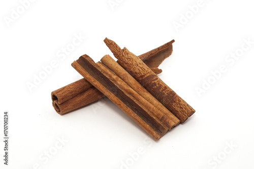 Closeup view of cinnamon stick isolated on white background