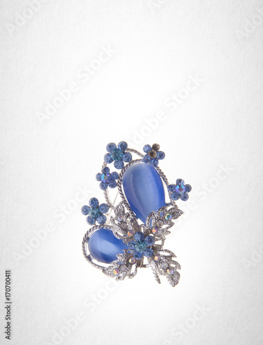 brooch or brooch with different gems on a background.