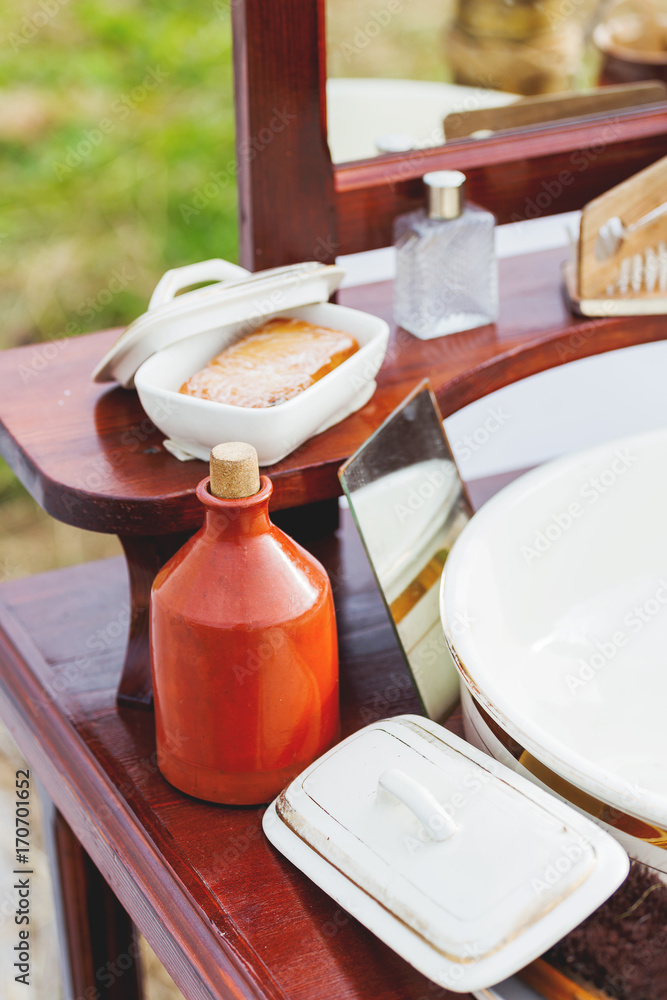 Φωτογραφία Old fashioned barber portable set - mirror, rowan tincture, razor, shaving brush, jar with water, nippers for moustaches, oil and ointments