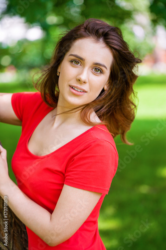 Beautiful brunette woman in sexy red dress