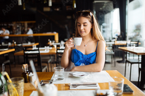 Beautiful woman enjoying her coffee