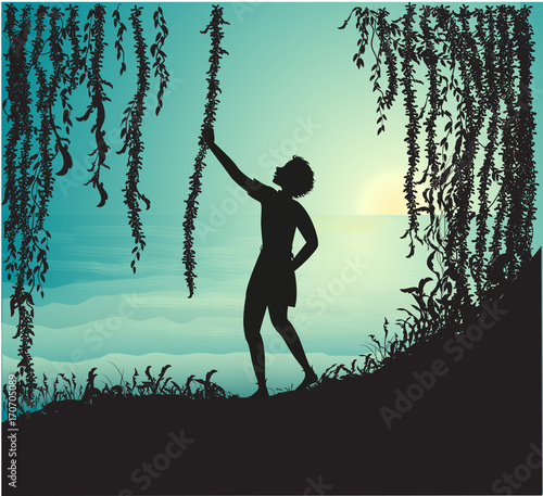 Boy holding liana silhouette in the cave and look at beautiful sea morning and sun rise  Peter Pan 