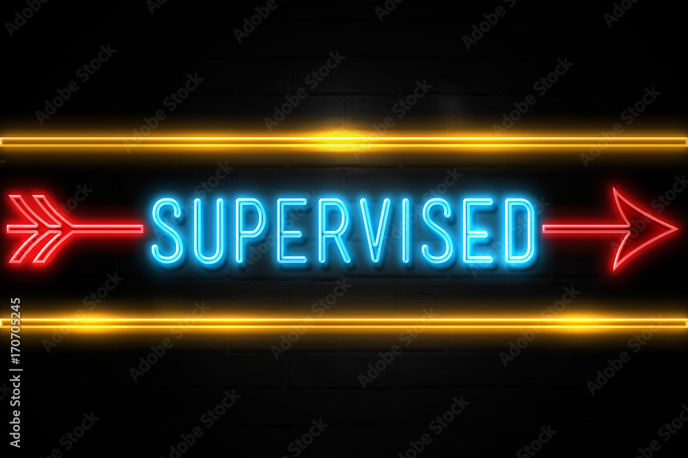 Obraz premium Supervised - fluorescent Neon Sign on brickwall Front view