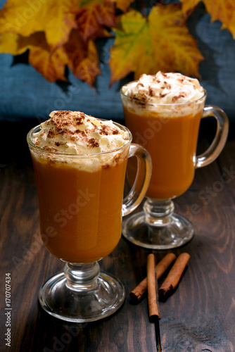 Pumpkin latte with whipped cream and cinnamon