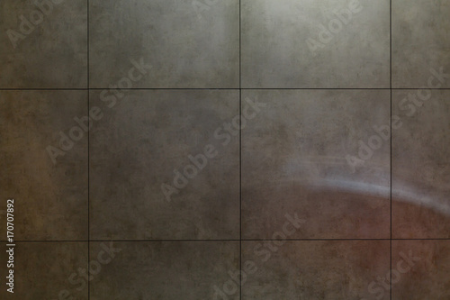 Wall grey tiles background.