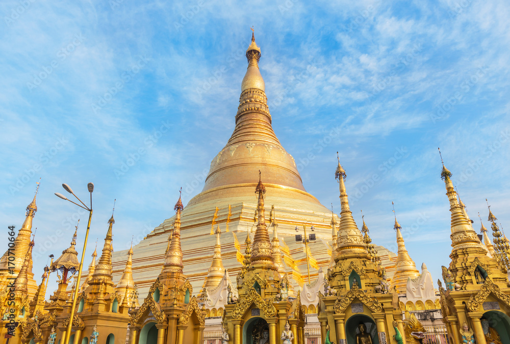Shwedagon big golden pagoda most sacred Buddhist pagoda in rangoon, Myanmar(Burma)  on blue sky background 