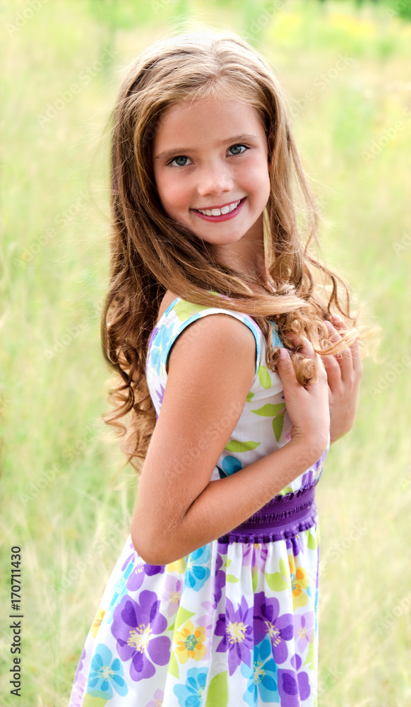 Portrait of adorable smiling little girl child in dress outdoor Portrait of adorable smiling little girl child in dress outdoor