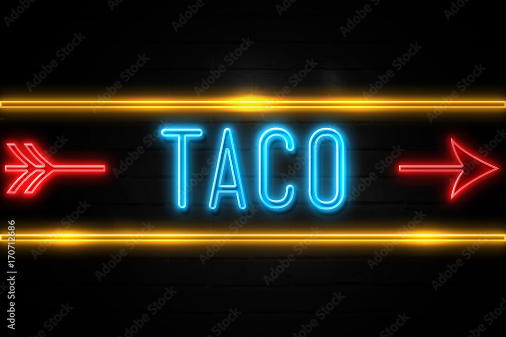 Taco - fluorescent Neon Sign on brickwall Front view Taco - fluorescent Neon Sign on brickwall Front view